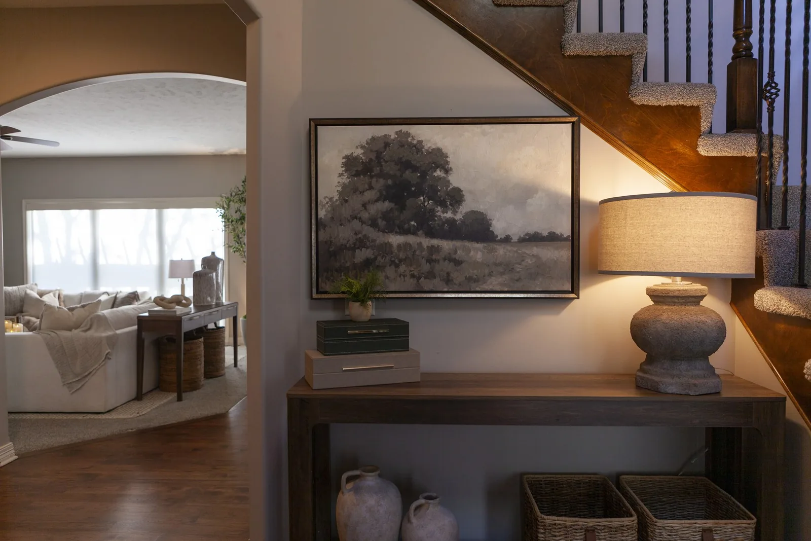 Warm, elevated entryway designed by Willow & Stone Interiors in an Omaha-area home