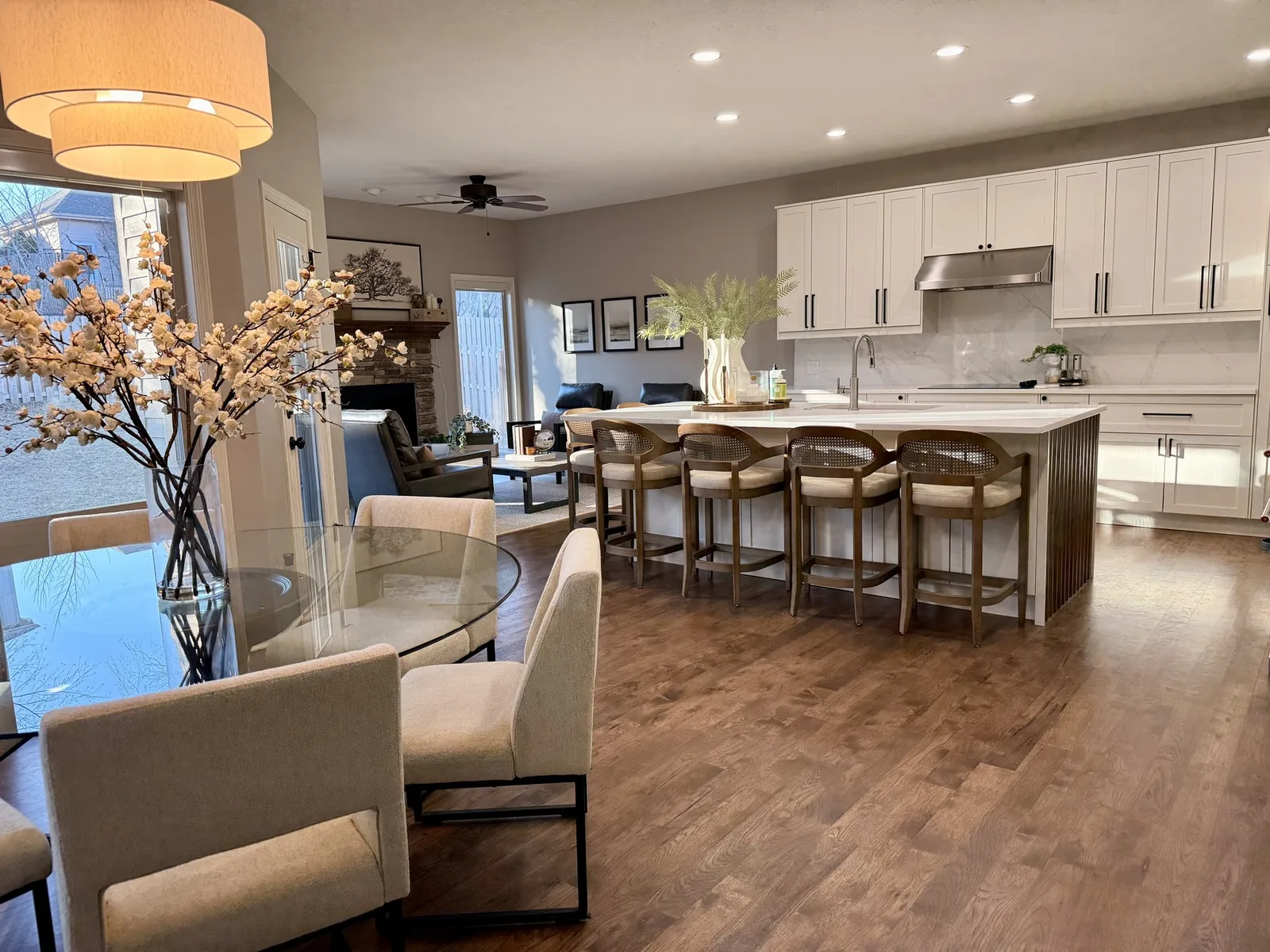 Bright white kitchen renovation with island seating in Omaha by Willow & Stone Interiors